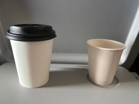 Paper cups in flight Stock Photos