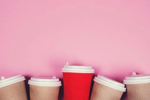 Paper cups on pink background Stock Photos