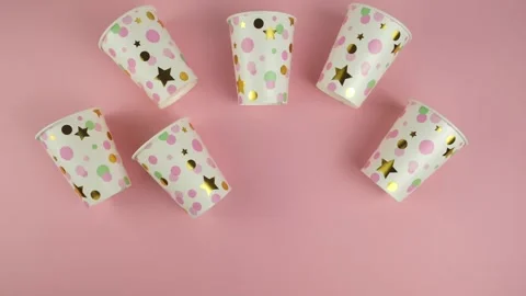 Paper cups on pink background. Stop motion animation Stock-Footage 152717169