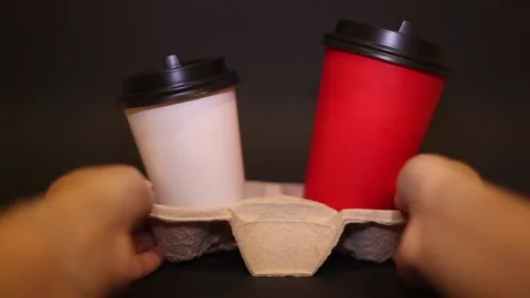 Paper cups red and white with coffee and cappuccino. Stock Footage 122370980