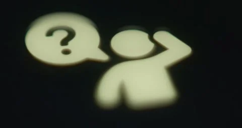 Paper cut human with a question mark withing a speech bubble near him Video stock 313436609