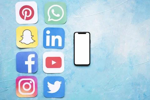 Paper cut outs social media icons arranged near smartphone Resolution and high Stock Photos