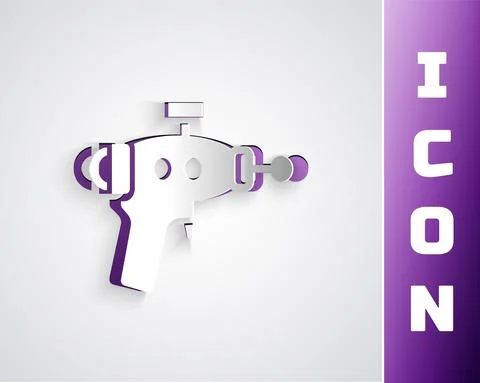 Paper cut Ray gun icon isolated on grey background. Laser weapon. Space blaster Stock-Illustration