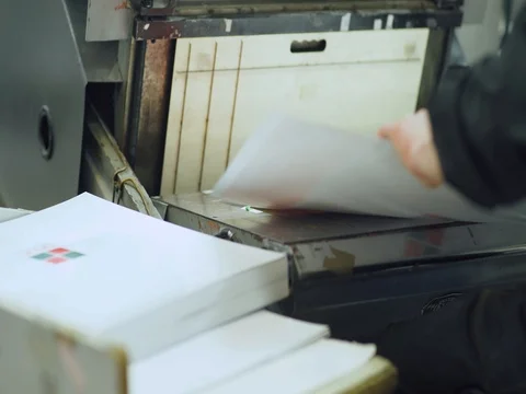 Paper cutting, worker, printing production, industrial machine. Print house. Stock Footage 72947298