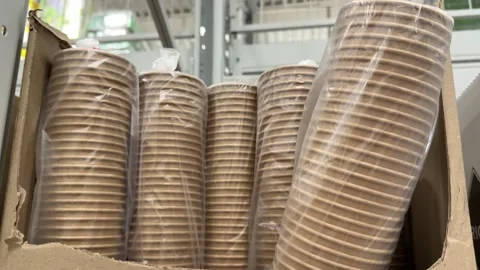 Paper dishes Disposable plastic cups packaged in clear bags and cardboard boxes Stock Footage 345172410