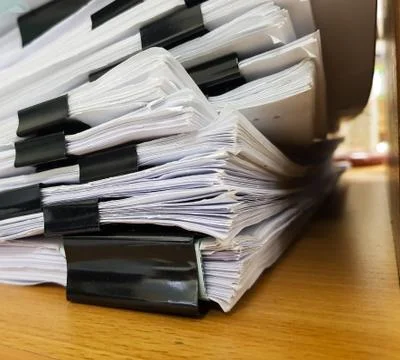 Paper Document with Black Binder clip on office c background. Foto stock