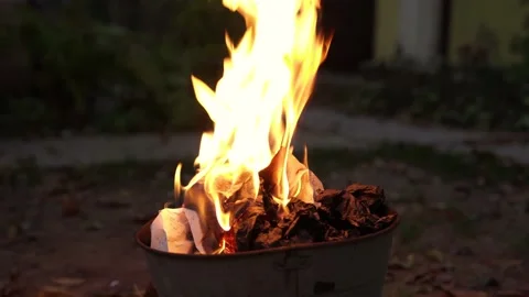Paper documents and letters burn in fire in the trash bucket Stock Footage 142741627