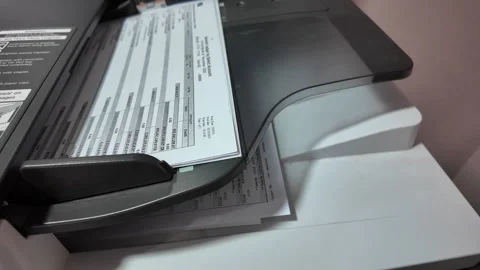 The paper documents are being sucked into the document scanner at high speed. 스톡 동영상 330273346