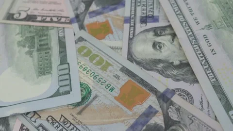 Paper dollar bills in shallow depth of field, slow motion. Video stock 287600725