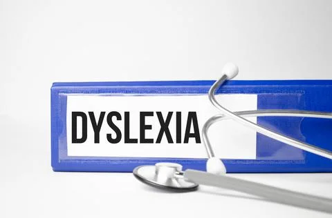 Paper with dyslexia on blue file folder and white background Stock Photos