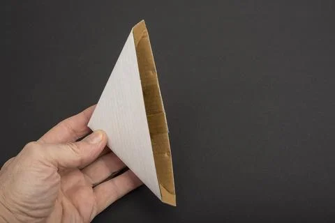 Paper Edge Corner Protector on a black. Protection In Packaging Stock Photos
