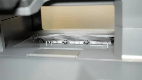 Paper Ejection from Printer in Slow Motion Stockbeeldmateriaal 320612150