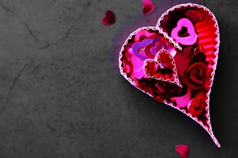 Paper elements in shape of heart on dark stone background. Love Valentine's.. Foto stock