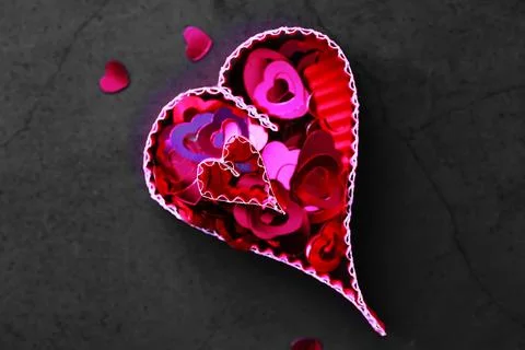 Paper elements in shape of heart on dark stone background. Love and Valentine Stock-Fotos