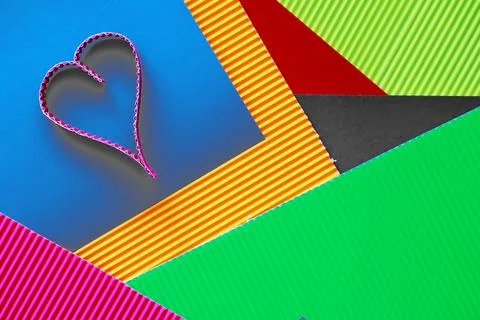 Paper elements in shape of heart on dark stone background. Love Valentine's.. Foto stock