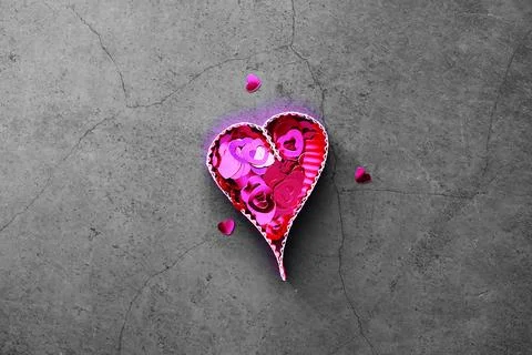 Paper elements in shape of heart on dark stone background. Love Valentine's.. 库存照片