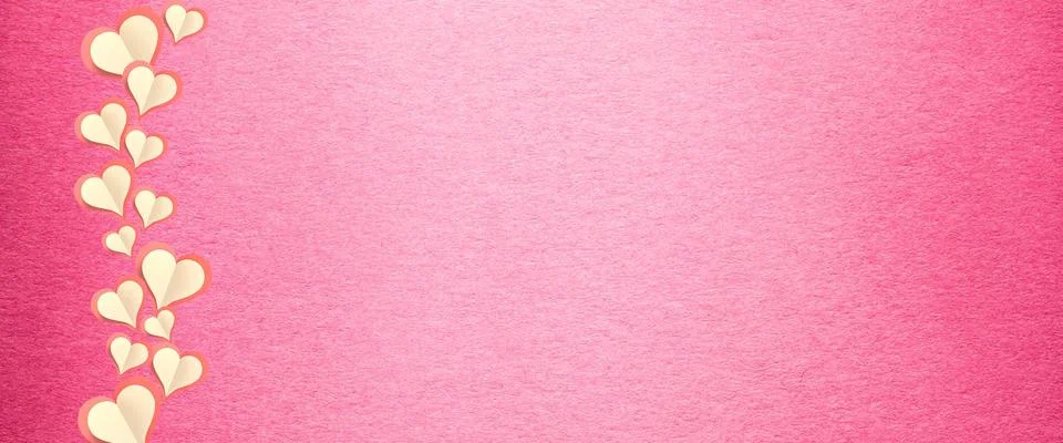 Paper elements in shape of heart flying on pink background. Symbols of love f 库存照片