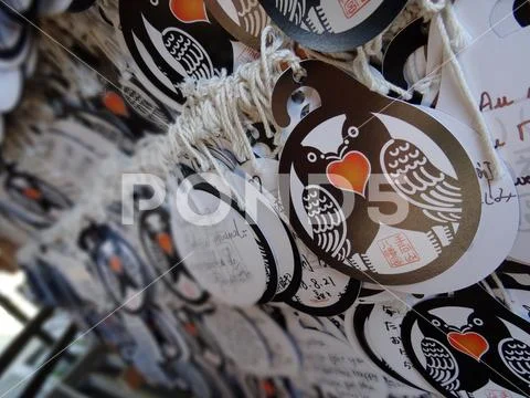 Paper Ema's (votive plaques) hanging at the Tamukeyama Hachimangu shrine Stock Photos