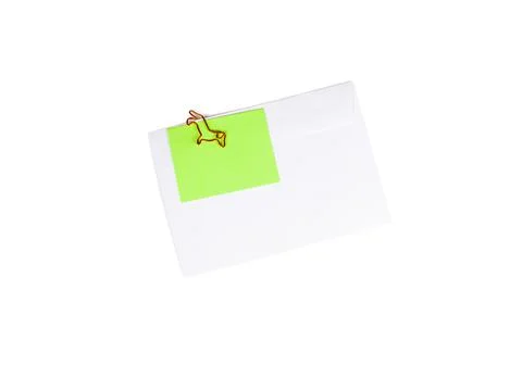 Paper envelope with blank note and dog-shaped paper clip on white background Stock Photos