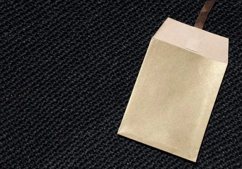 Paper envelope on a seamless knitted pattern. The background is crocheted w.. Stock Photos