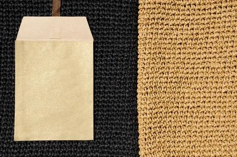 Paper envelope on a seamless knitted pattern. The background is crocheted w.. Stock Photos