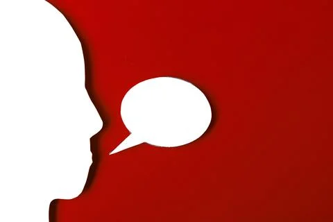 Paper face and speech bubble on colorbackground copy space for text, commun.. Stock Photos