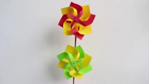 Paper fan is spinning Stock Footage 72975383