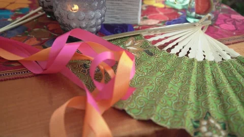 Paper fan on a table - party Stock Footage 191290593