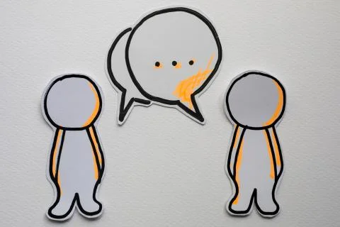 Paper figures with speech bubbles on the white Stock Photos