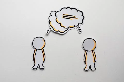 Paper figures with speech bubbles on the white Stock Photos