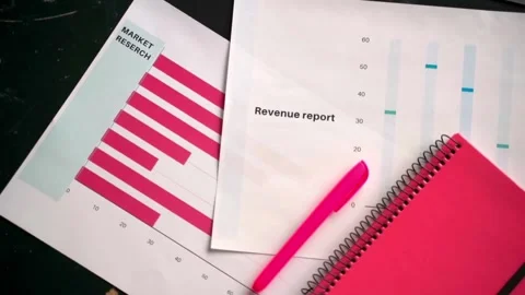 Paper of financial analysis and printed charts on table work office 库存影片 334653972