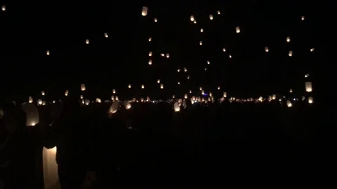 Paper fire lanterns floating in a dark sky Stock Footage 124391068