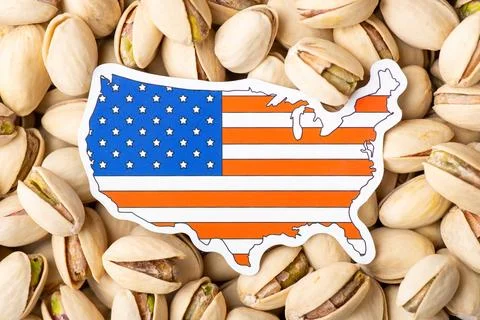 Paper flag and map of USA on pistachio Stock Photos