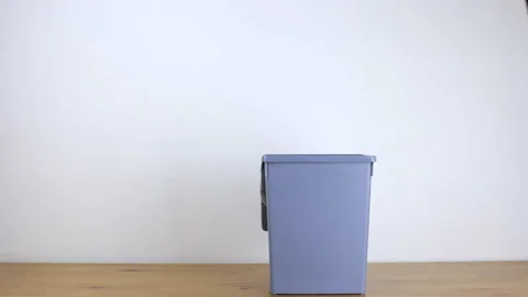 Paper flies into an office bin Stock Footage 102861769