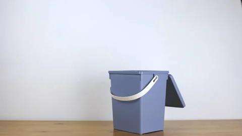 Paper flies into an office bin that quickly fills Stock Footage 102861936