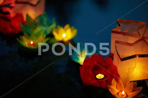 Paper flower lanterns floating in a line at east festival Stock Photos