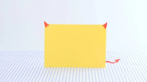 The paper in form of devil with horns and a trident on a dotted background 動画素材 73010457