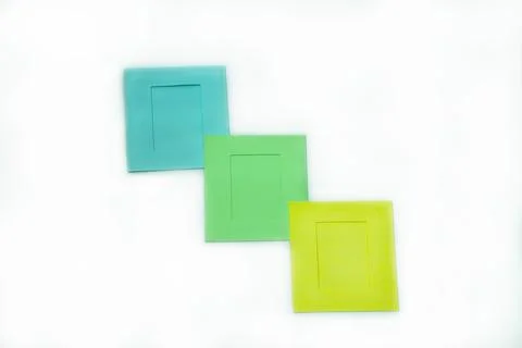 Paper frames of different colors in close-up on white background. Foto stock
