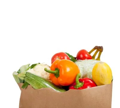 Paper grocery sack with vegetables on white Stock Photos