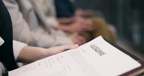 Paper, hands and waiting room with resume for interview, job opportunity or Stock-Footage 340792863
