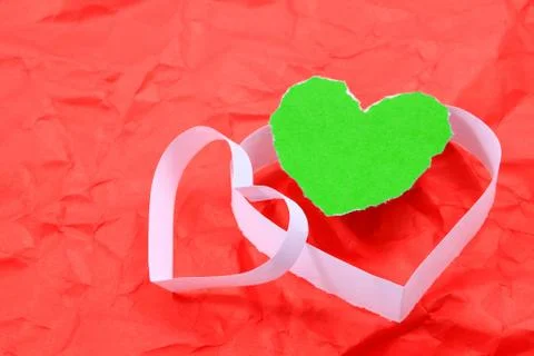 Paper hearts on red background Stock Photos