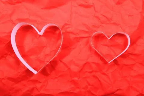 Paper hearts on red background Stock Photos