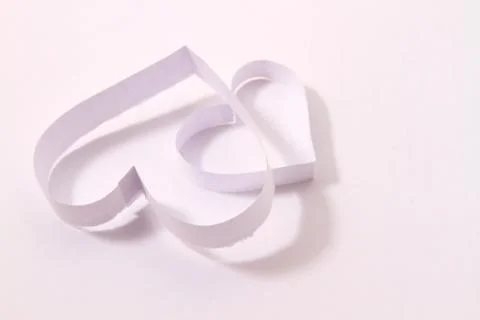 Paper hearts on white background Stock Photos