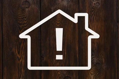 Paper house with exclamation point inside. Conceptual image Stock Photos