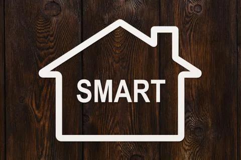 Paper house with smart text inside. Housing, family concept Stock Photos