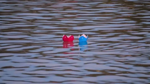 A paper lantern in the shape of a flower, with a burning candle in the center Stock Footage 303172985