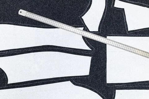 Paper layout of sewing patterns and steel ruler Stock Photos