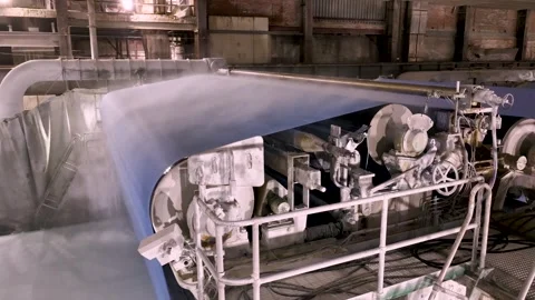A paper-making machine. Cellulose is distributed in a thin layer by watering Stock Footage 325793456