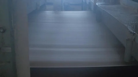 Paper making machine draws a huge sheet of a cardboard Stock Footage 97579685