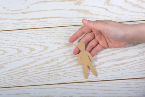 Paper man shape in hand in the view Stock-Fotos